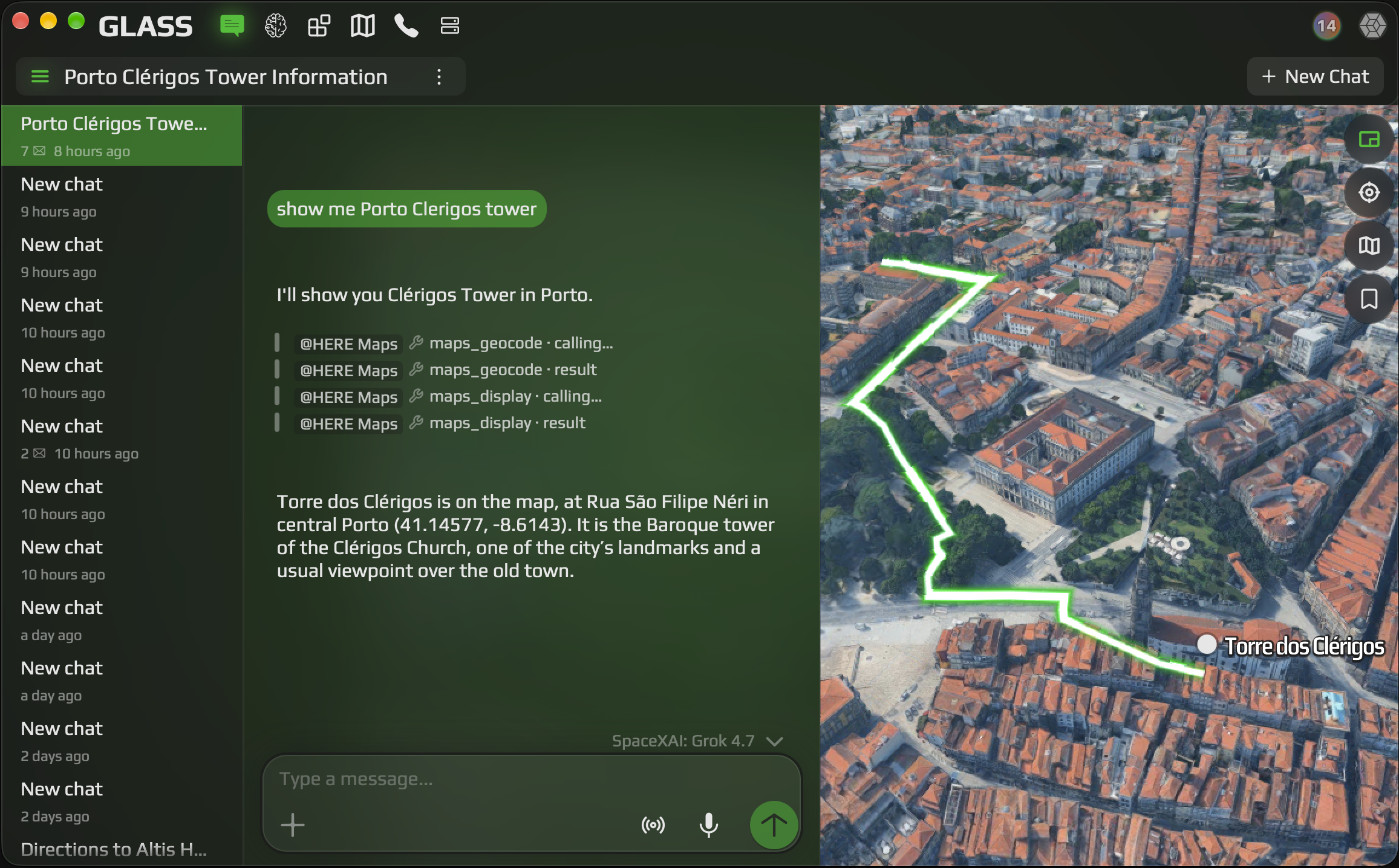 Glass on a desktop, with a chat about Clérigos Tower beside an aerial map of Porto